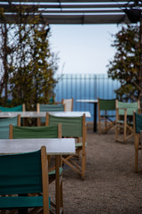 Summer restaurant terrace on shore with sea views