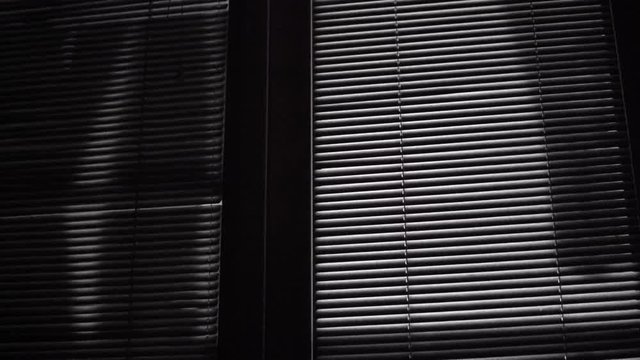 Horror Scene Of Moving Laundry Shades On Venetian Blinds At Night