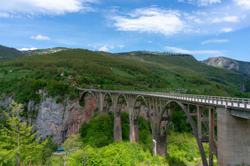Fototapeta na wymiar Tara river canyon. Most popular place for visit is the Durdevica bridge. Jurjevich Bridge in Zabljak, Montenegro