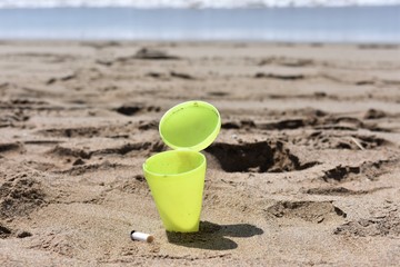 Beach ashtray embedded in the sand