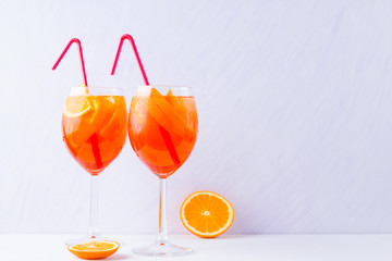 Cocktail Aperol Spritz with mint leaves on a white background. Italian cocktail aperol spritz on white background