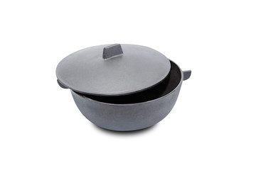 Large black cast iron pan with opened lid on white background. Isolated on white background. With...