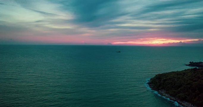 Aerial hyperlapse tracking over the sea during beautiful sunset