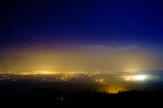 Light pollution in a foggy night, Portugal.