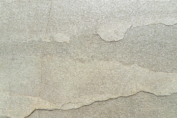 Texture of natural stone with a crack. Background of natural stone gray with a split. Texture with destruction and crack.