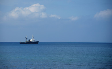 Fototapeta na wymiar Sea, horizon, clouds and ship
