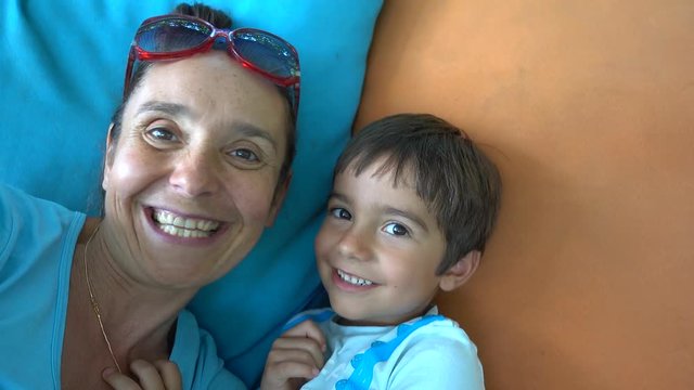 4K Selfie loveful mother and son kiss each other one by one, crystal child 