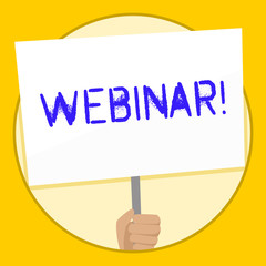 Text sign showing Webinar. Business photo text seminar or other presentation types that takes place on Internet Hand Holding Blank White Placard Supported by Handle for Social Awareness
