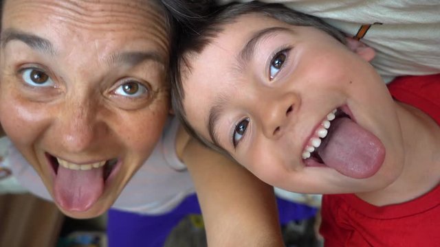 4K Top view Selfie of mother and son pulling faces