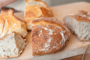 Sliced bread on wooden background, close up