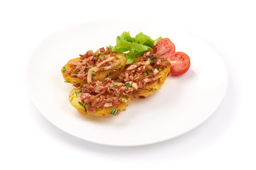 Baked loaded potatoes with bacon, close-up, isolated on white background