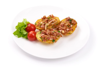 Baked loaded potatoes with bacon, close-up, isolated on white background