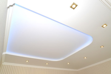 Trapezoid design and dot lamps on an opaque stretch ceiling