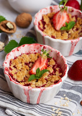 Crumble pie with strawberries. Delicious portion sweet dessert