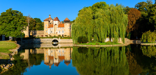 Fototapeta na wymiar Beautiful reflection of the Sercy Castle in Burgundy region, France.
