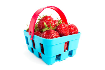 Basket of ripe fresh strawberries isolated on white background. Fresh ripe strawberries in blue basket. Healthy concept