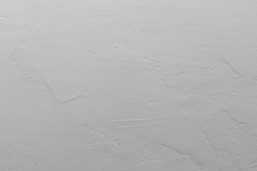 Texture of white plaster. Covering the concrete wall of the house. Rough surface. Repair and construction.