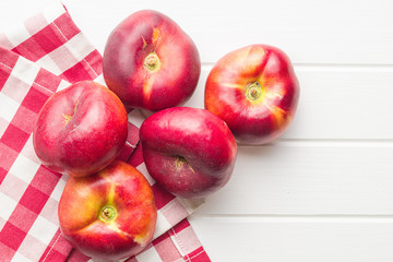 Ripe flat nectarines.