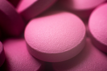 Obraz na płótnie Canvas Pink tablets macro. Pink medicines background. Close up. Tablets concept.