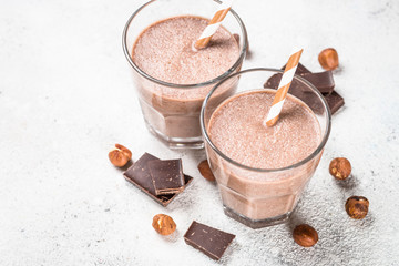Chocolate coconut hazelnut milkshake or smoothie top view.