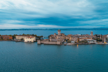 Fototapeta na wymiar Aerial shot of Sirmione peninsula and the castle in the middle of Lake Garda