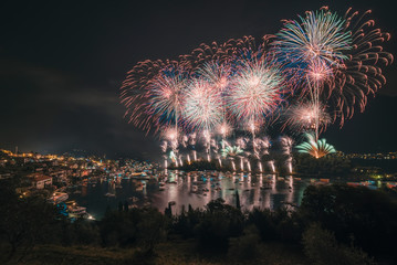 Fireworks on Comacina Island for the San GIovanni Festival in Ossuccio in long exposure with multiple colours