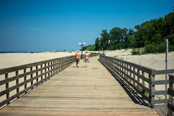.wooden promenade on the sea beach