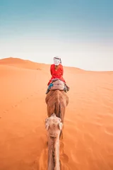 Zelfklevend Fotobehang Marokko A tourist woman on the dromedary in Morocco desert