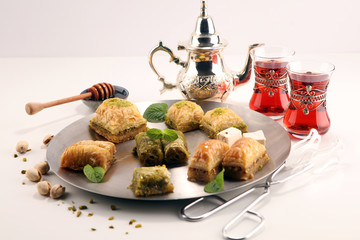 Middle eastern or arabic dishes. Turkish Dessert Baklava with pistachio on dishes