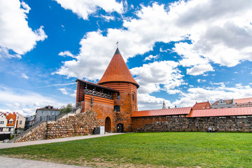 Historical gothic Kaunas Castle from medieval times in Kaunas, Lithuania. Wide angle panoramic view on cloudy sky background