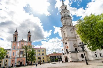 Fototapeta premium Town Hall White Swan in the center of Kaunas at the Town Hall Square in Lithuania in the spring against a blue sky with cirrus clouds. Kaunas, Lithuania – May, 2019