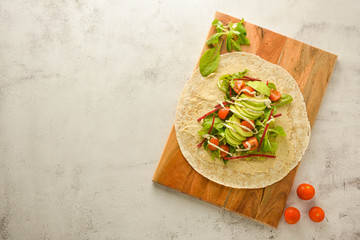 Wraps or torttila. Open avocado, vegan wraps. Healthy food. Copy space.
