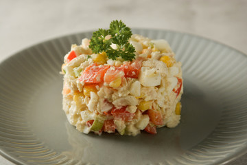 Chicken meat salad with mayonnaise and vegetables.