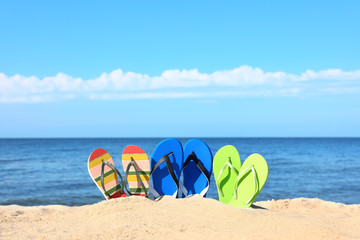 Fototapeta na wymiar Composition with beach accessories on sand near sea in summer