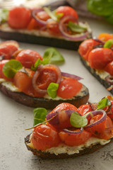 Bruschetta with cherry tomatoes and cheese cream. Healthy, vegan food, snack.