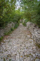 Sauve, France - 06 06 2019: stone path in the sea of rocks