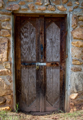 Stone storage shed with wooden door