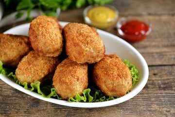 Fried meat balls with boiled quail egg inside.