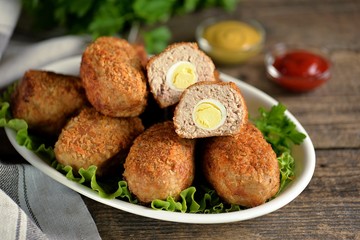 Fried meat balls with boiled quail egg inside.
