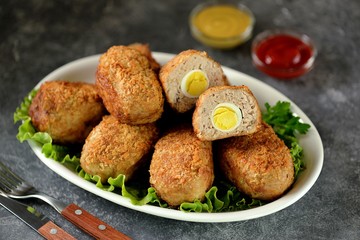 Fried meat balls with boiled quail egg inside.