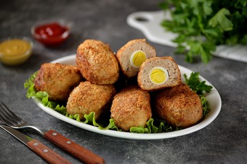 Fried meat balls with boiled quail egg inside.