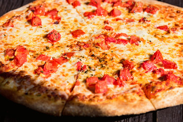 Delicious fresh pizza Margherita with tomatoes and cheese close up