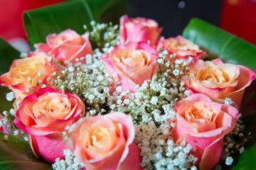 Beautiful bouquet of roses close-up . Pink and yellow mixed Rose, beautiful nature background . Artificial roses on table,Love valentine concept