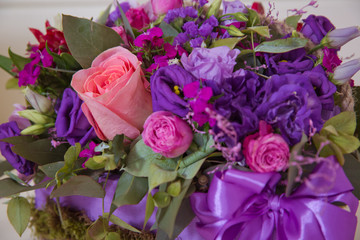 Beautiful wedding colorful purple bouquet for bride. Beauty of colored flowers. Flowers backgrounds . Four-legged rose bush . Beautiful bunch of purple flowers with white, red and yellow flowers .