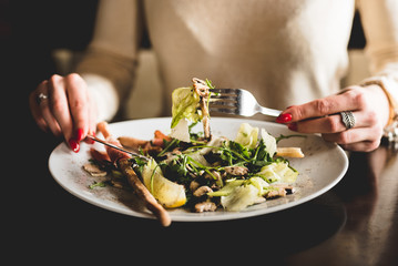 woman eating salad