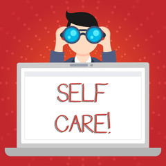Text sign showing Self Care. Business photo showcasing practice of taking action to preserve or improve ones own health Man Holding and Looking into Binocular Behind Open Blank Space Laptop Screen
