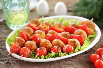 Grilled mushrooms, onions, peppers and cherry tomatoes on wooden skewers. Vegetable kebabs. Healthy food.