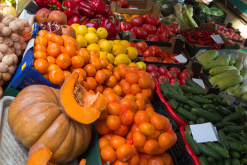 pumpkin and apelsins and other vegetables in sale in outdoor farmer market