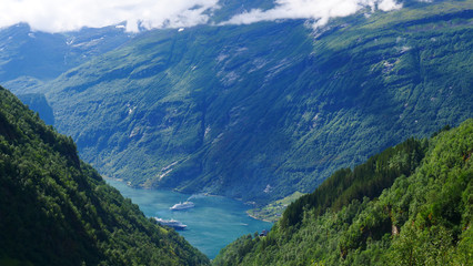 Obraz premium Fjord Geirangerfjord with ferry boat, Norway.