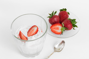 Delicious strawberry ice cream scoop with fresh strawberries on wooden background